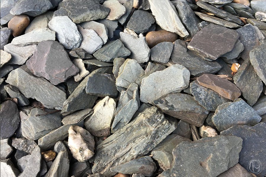 grey slate chippings close up of grey slate chippings