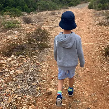 Child walking along a crushed gravel path