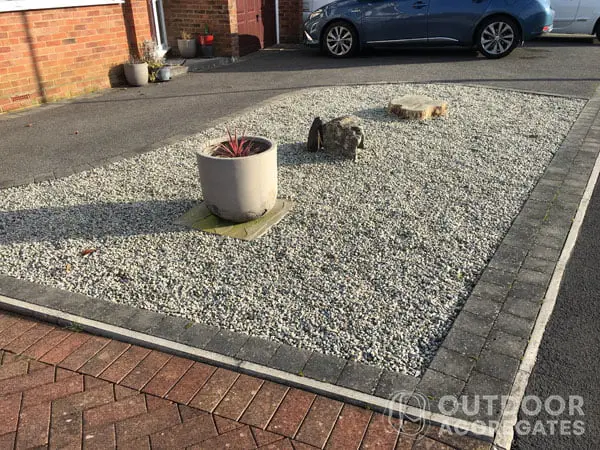  Brick edging around grey granite chips